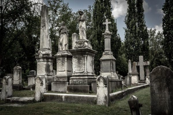 Cazenove family burial plot in the Presbyterian Cemetery, showing multiple monuments and an ornate obelisk in the foreground belonging to William Gardner Cazenove.