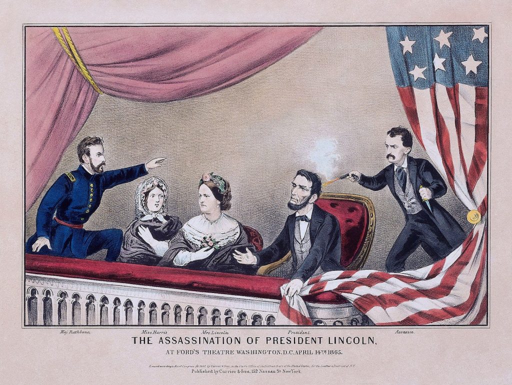 Hand-colored lithograph by Currier & Ives depicting the assassination of Abraham Lincoln in 1865. From left to right: Henry Rathbone, Clara Harris, Mary Todd Lincoln, Abraham Lincoln, and John Wilkes Booth. Booth is shown firing his weapon at Lincoln while Rathbone attempts to intervene. Lincoln clutches a flag, possibly reacting to the shot or moving it aside.