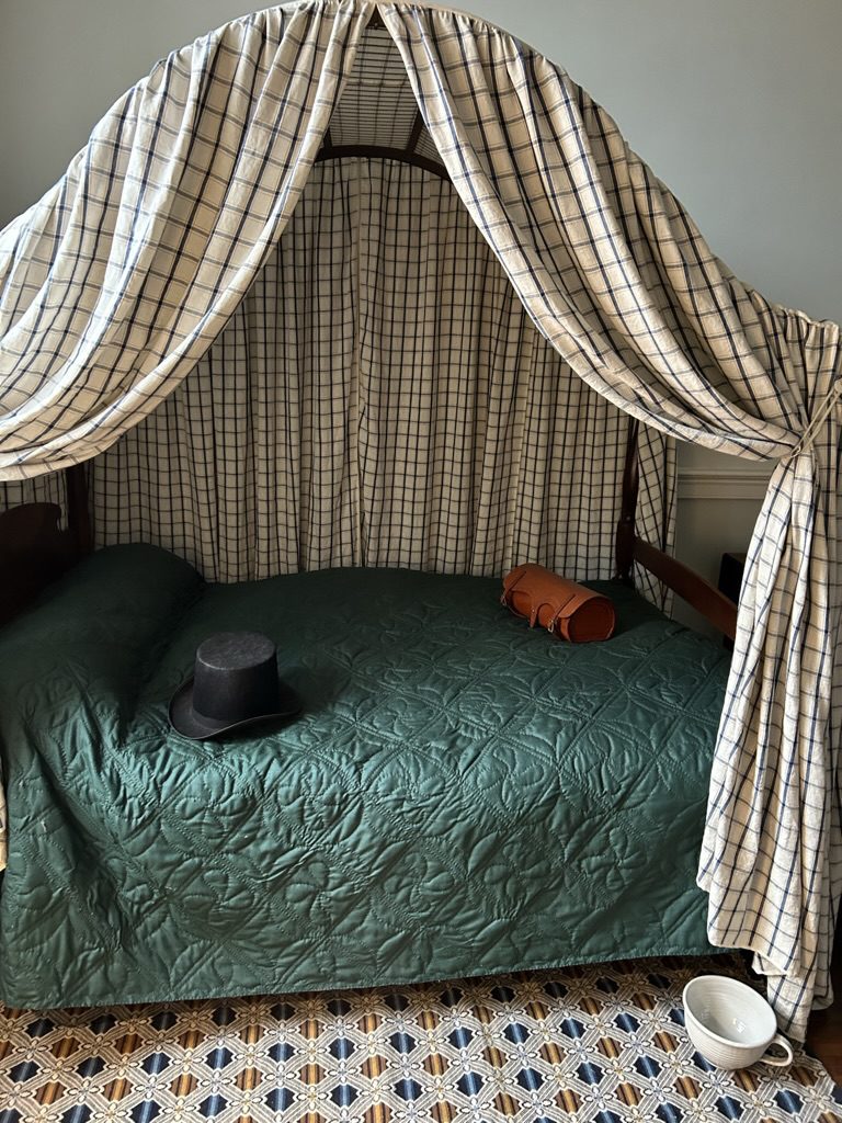 Female Stranger’s grave in Alexandria connected to Gadsby’s Tavern, showing the bed in the East Bedchamber where the mysterious woman is believed to have died in 1816.