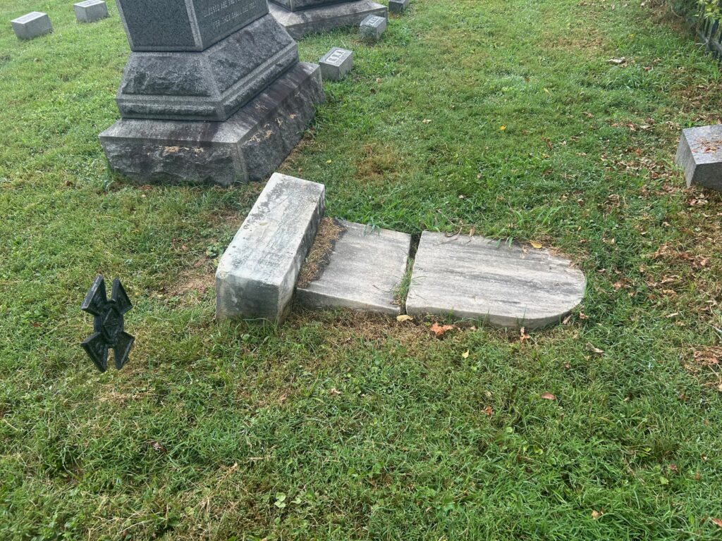 The broken gravestone of Delaware B. Kemper in St. Paul’s Cemetery, Alexandria, Virginia. The stone lies in two fractured pieces flat on the ground beside a larger family monument. A Confederate veteran’s iron marker stands nearby. Kemper commanded the Alexandria Light Artillery at the First Battle of Manassas, where his guns helped break the Union retreat at Cub Run Bridge in July 1861. Despite later wounds, he rose to Colonel of Artillery and, after the war, became a professor and U.S. consul.