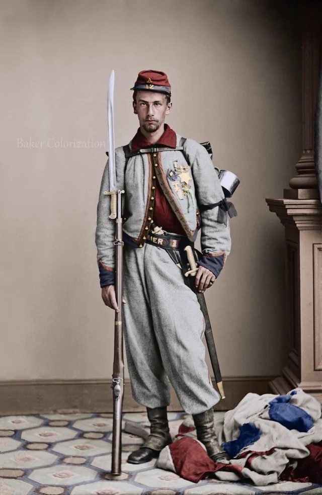 Colorized portrait of Private Francis E. Brownell of the 11th New York “Fire Zouaves,” shown in full Zouave uniform with musket and bayonet. Brownell was later awarded the Medal of Honor for avenging the death of Colonel Elmer Ellsworth at the Marshall House in Alexandria.