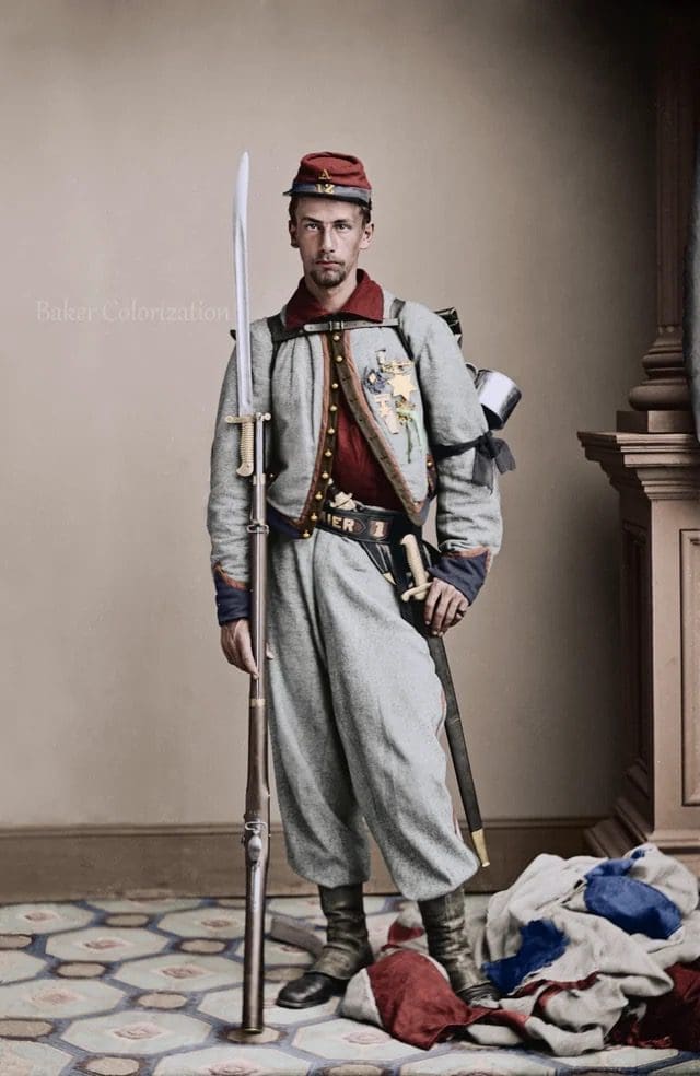 Colorized portrait of Private Francis E. Brownell of the 11th New York “Fire Zouaves,” shown in full Zouave uniform with musket and bayonet. Brownell was later awarded the Medal of Honor for avenging the death of Colonel Elmer Ellsworth at the Marshall House in Alexandria.