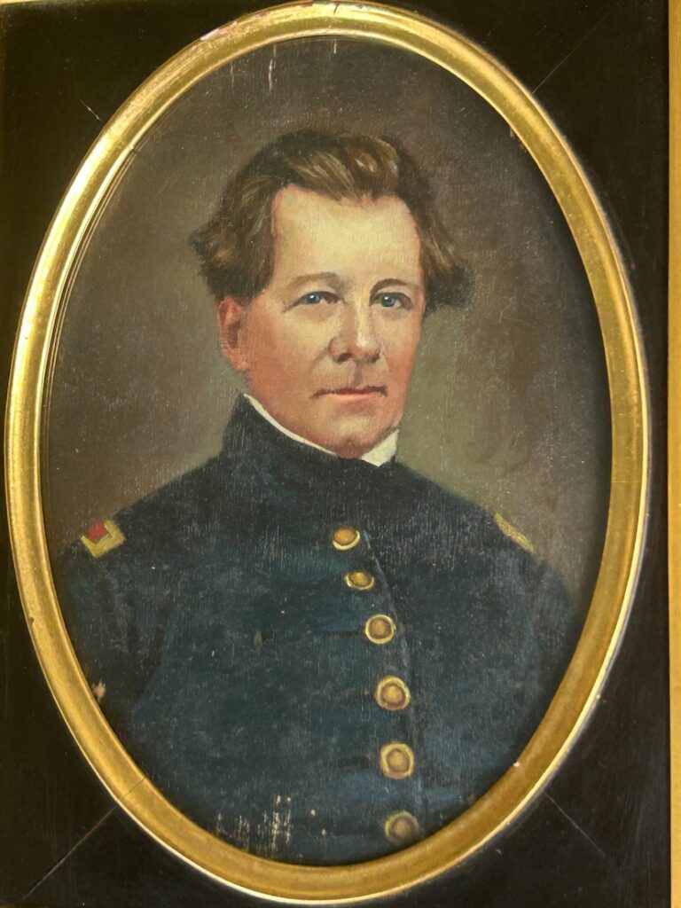 An oval-framed painted portrait of Major Richard Bland Lee II, shown from the chest up wearing a dark military coat with brass buttons and shoulder straps. He has light skin, short brown hair brushed back, and a calm, direct expression. Image photographed by David Heiby in 2025 with permission of the Lee/Fleming family at Green Mount.