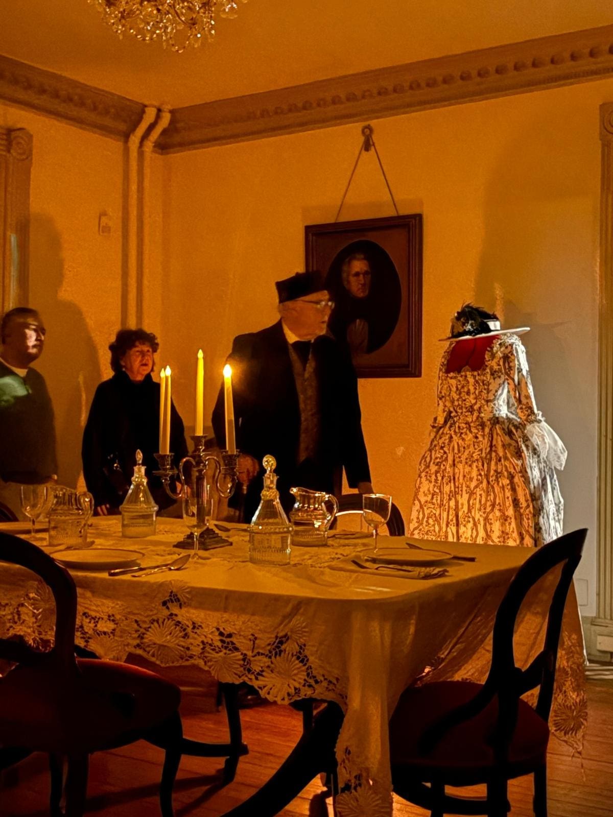 Living history Alexandria — David Heiby in period costume as 19th-century Mayor E.E. Downham leading a candlelight tour in the historic North Dining Room of the Lee-Fendall House Museum
