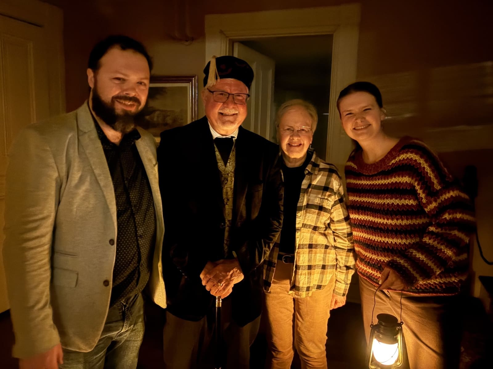 Living history Alexandria — public historian David Heiby in costume as Mayor E.E. Downham with guests at the Lee-Fendall House Museum, following the sold-out February 2026 candlelight lantern tour