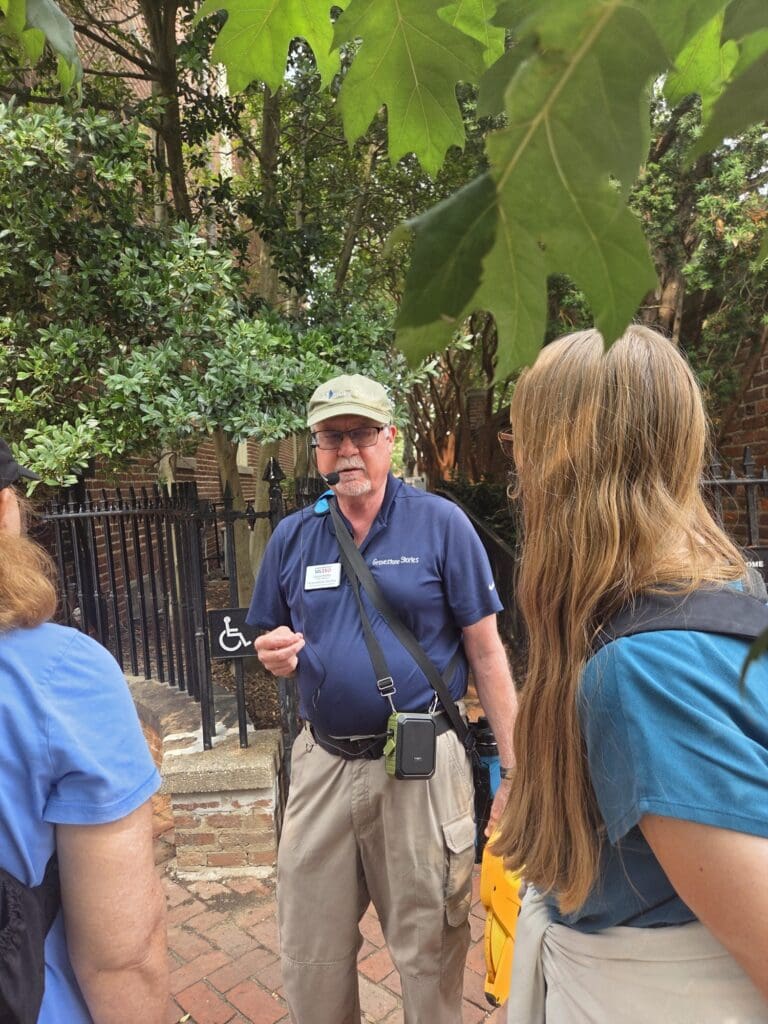 David Heiby speaks to a group gathered outside the Old Presbyterian Meeting House during a historical walking tour.